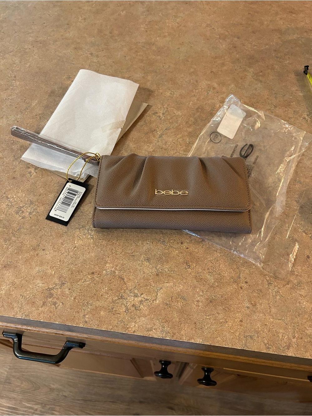 bebe Taupe/Light Brown Wristlet Clutch with Gold Logo